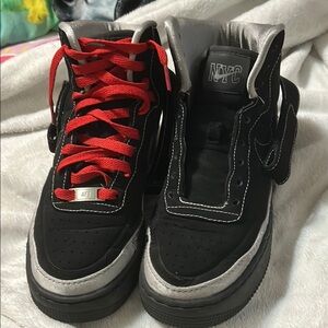 Nike Black and Red Sneakers with Suede Upper and Bold Red Laces